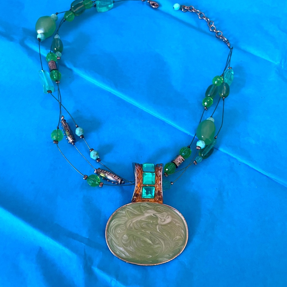 Beautiful green and gold-colored beaded necklace.